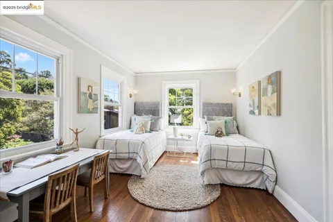 a bedroom with a bed and a table