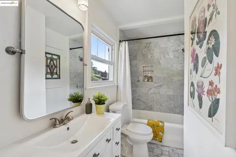 a kitchen with a potted plant on the counter and cabinets