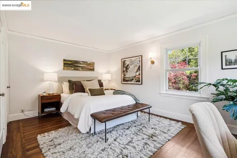 a view of bathroom with a toilet a sink and a large mirror