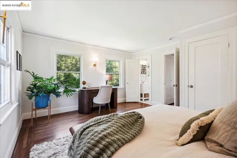 a living room with furniture and a dining table