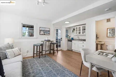 a white toilet sitting next to a bathroom sink