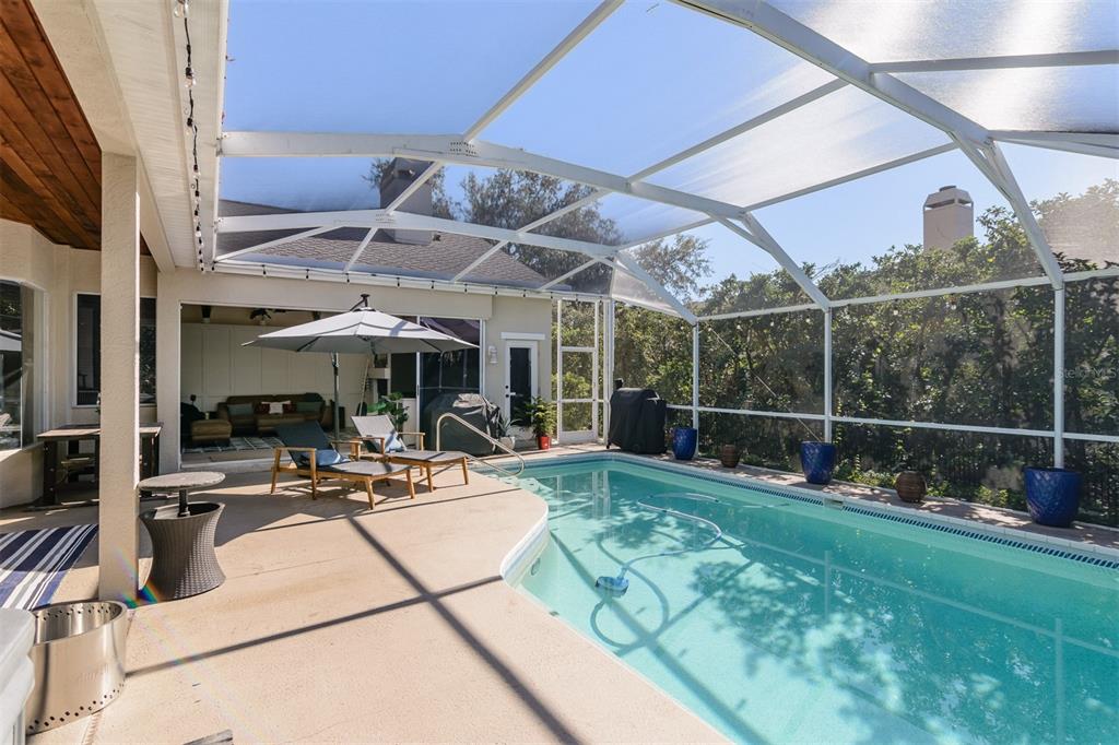 4324 Auston Way Palm Harbor, FL 34685 - Photo 36 of 54 a view of a patio with chairs and tables