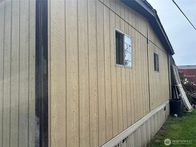 a view of a patio with wooden floor