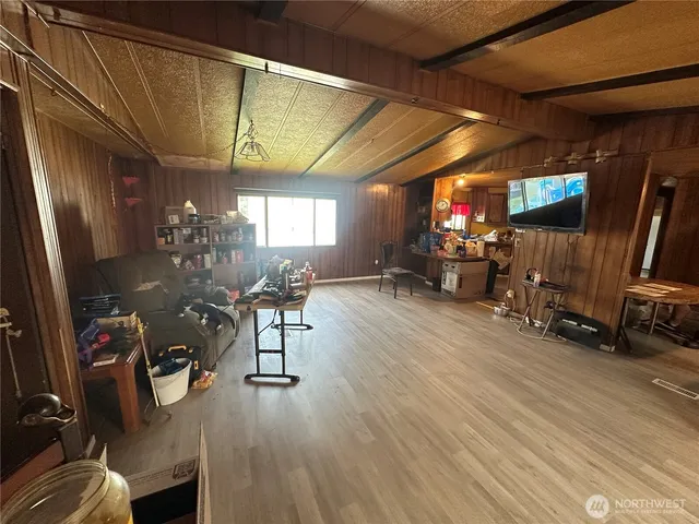 a bathroom with shower and mirror