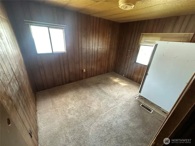 a view of walk in closet with clothes and water camper