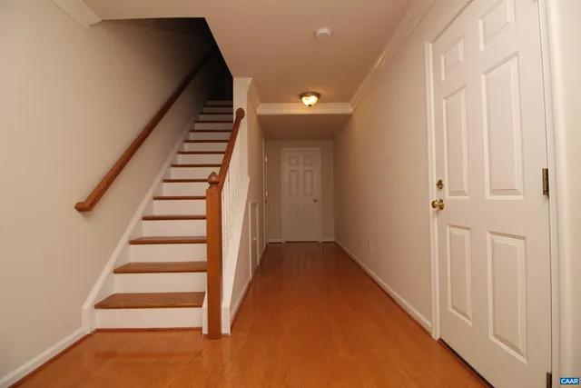 a view of entryway with wooden floor