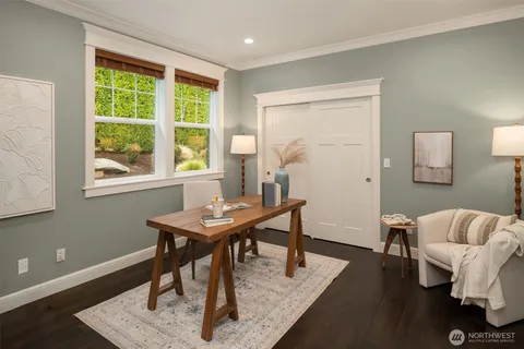 a view of a livingroom with furniture and a window