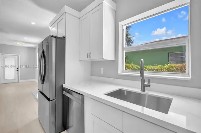 a kitchen with a stove and a microwave