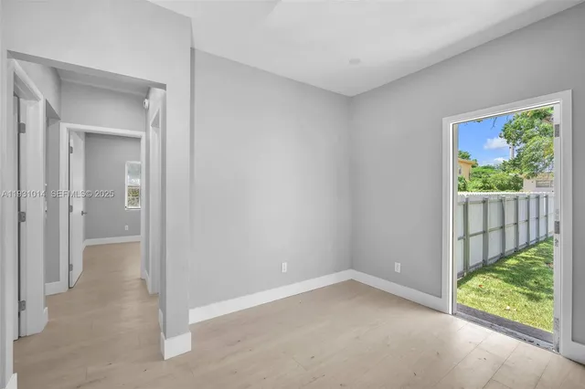 a backyard of a house with wooden fence