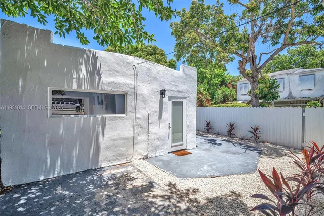 a backyard of a house with seating space