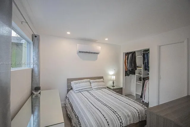 a bed room with a bed and furniture