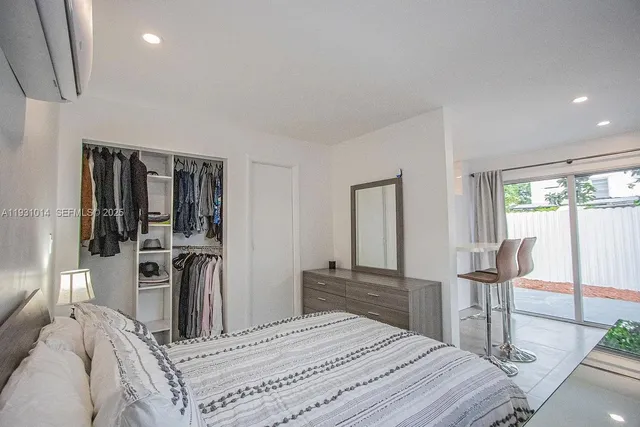 a kitchen with stainless steel appliances a refrigerator sink and stove