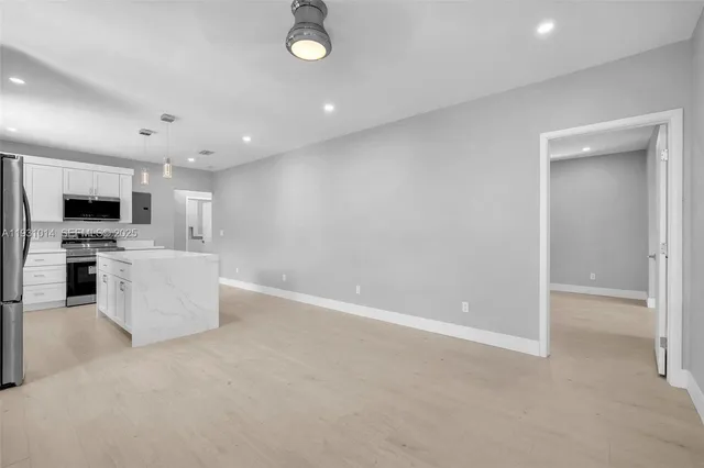 a view of a kitchen with a sink
