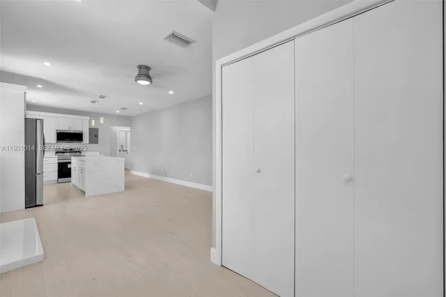 a view of a kitchen with washer and dryer