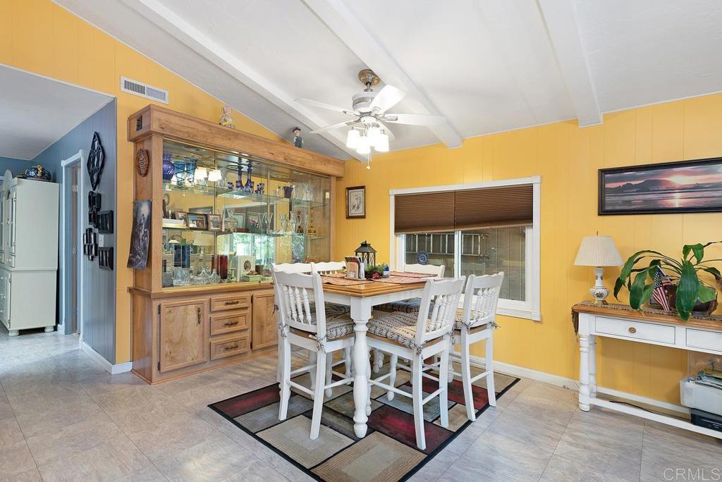 18218 Paradise Mountain Road Valley Center, CA 92082 - Photo 11 of 37 a view of a dining room with furniture window and outside view