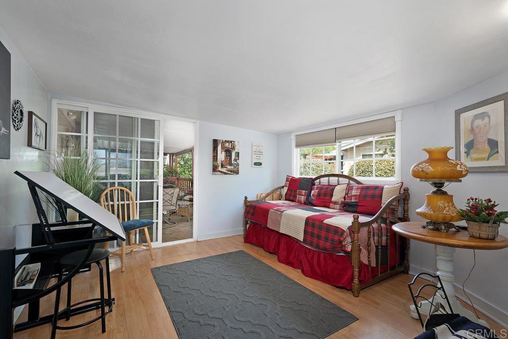 18218 Paradise Mountain Road Valley Center, CA 92082 - Photo 20 of 37 a bedroom with furniture and a window