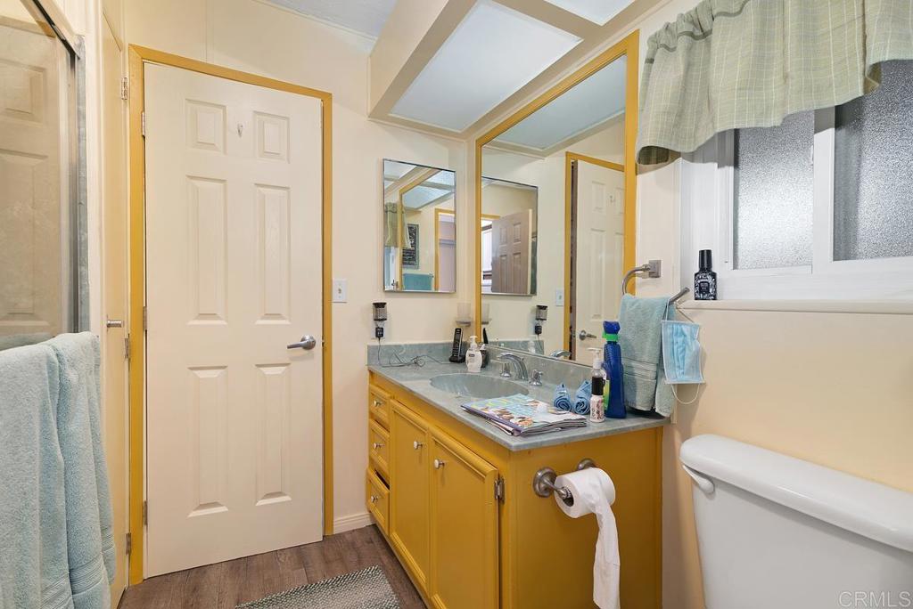 18218 Paradise Mountain Road Valley Center, CA 92082 - Photo 26 of 37 a bathroom with a sink and a mirror