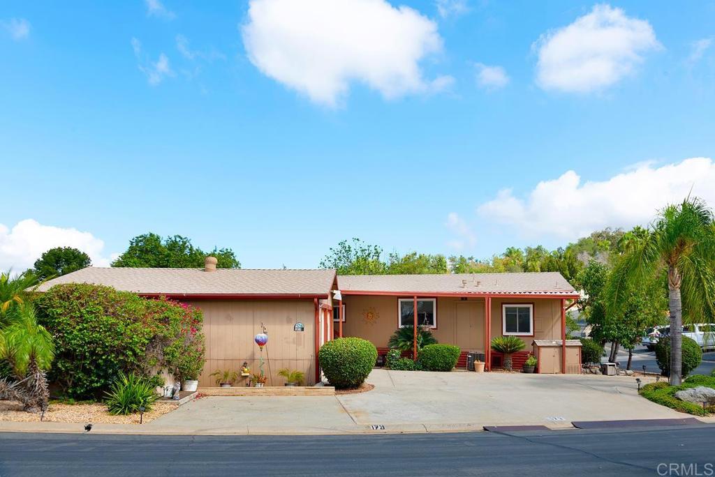 18218 Paradise Mountain Road Valley Center, CA 92082 - Photo 3 of 37 a front view of a house with garden