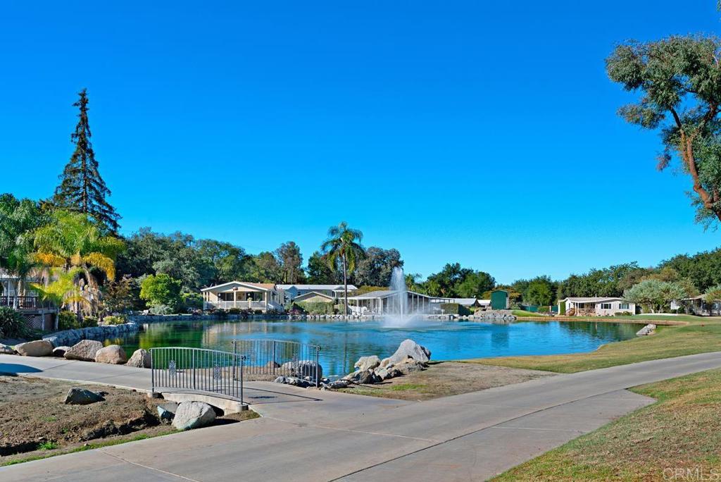 18218 Paradise Mountain Road Valley Center, CA 92082 - Photo 34 of 37 a view of a lake with houses