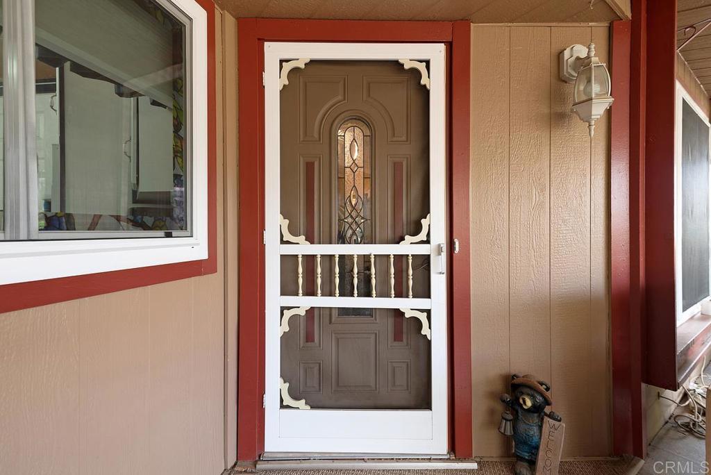 18218 Paradise Mountain Road Valley Center, CA 92082 - Photo 5 of 37 a view of a front door of a house