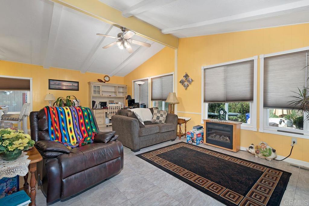 18218 Paradise Mountain Road Valley Center, CA 92082 - Photo 6 of 37 a living room with furniture and a couch