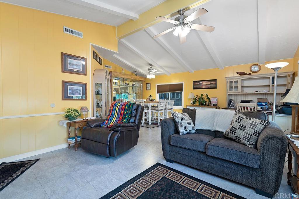 18218 Paradise Mountain Road Valley Center, CA 92082 - Photo 7 of 37 a living room with furniture and wooden floor