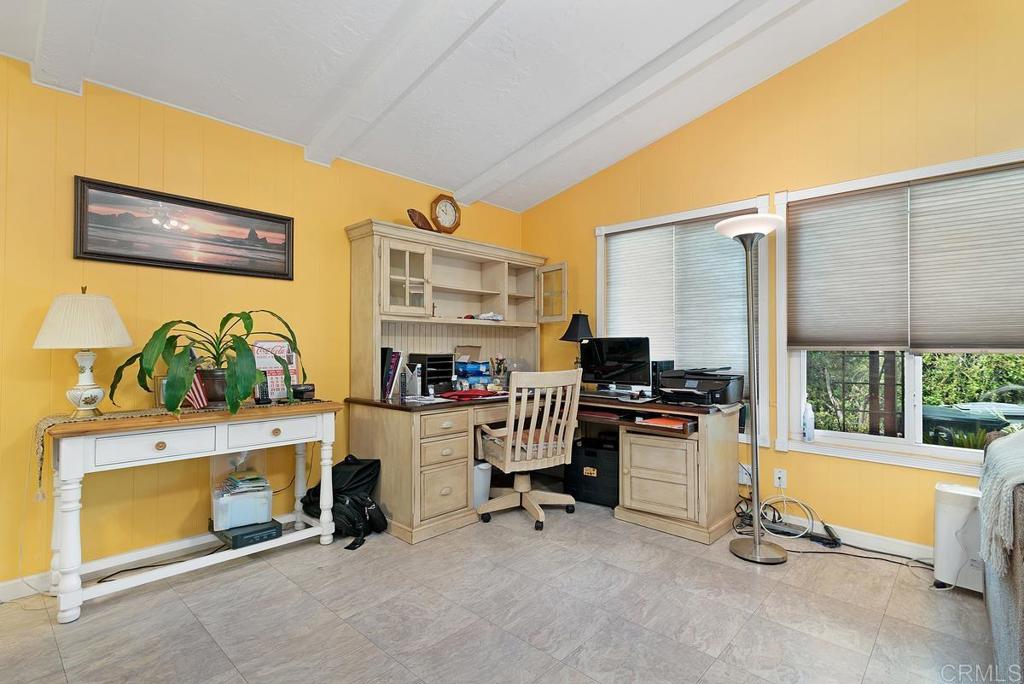 18218 Paradise Mountain Road Valley Center, CA 92082 - Photo 9 of 37 a room with furniture and a fireplace