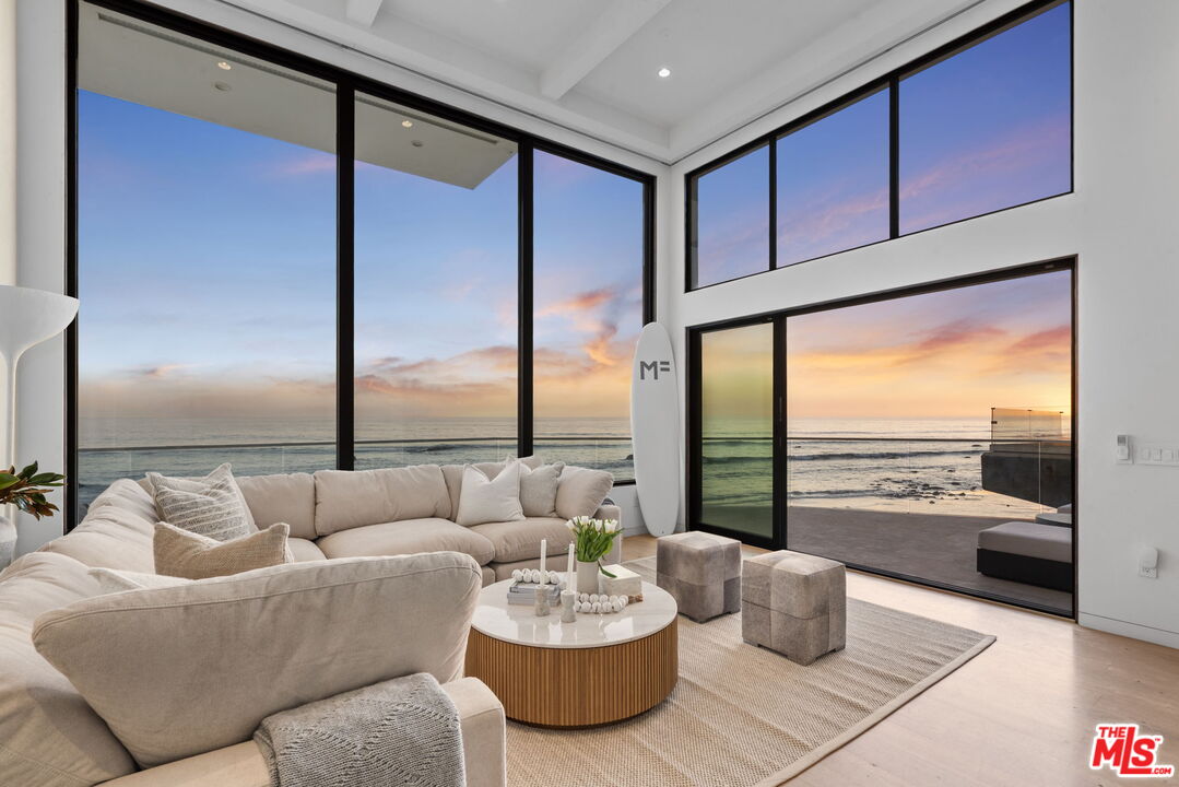 24146 Malibu Road Malibu, CA 90265 - Photo 2 of 25 a living room with furniture and a large window