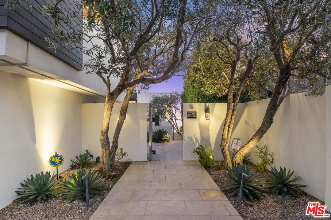 24146 Malibu Road Malibu, CA 90265 - Photo 23 of 25 a house with trees in front of it
