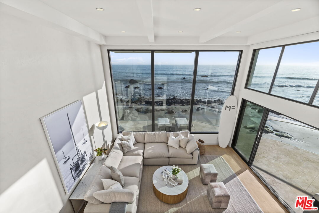 24146 Malibu Road Malibu, CA 90265 - Photo 10 of 25 a view of a livingroom with furniture window and wooden floor