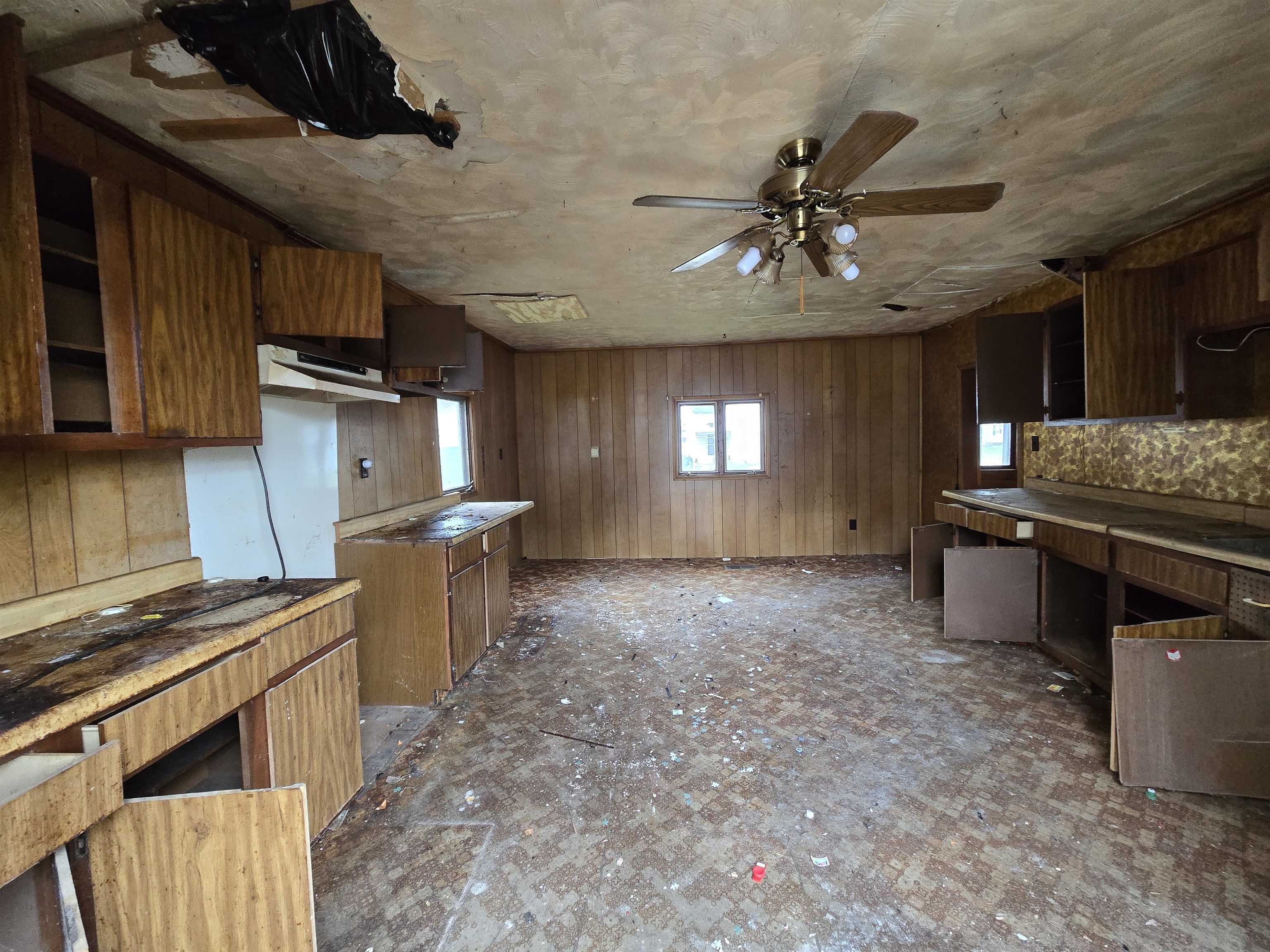 412 East Colden Street Polo, IL 61064 - Photo 6 of 11 a kitchen with stainless steel appliances granite countertop a sink a stove and a refrigerator
