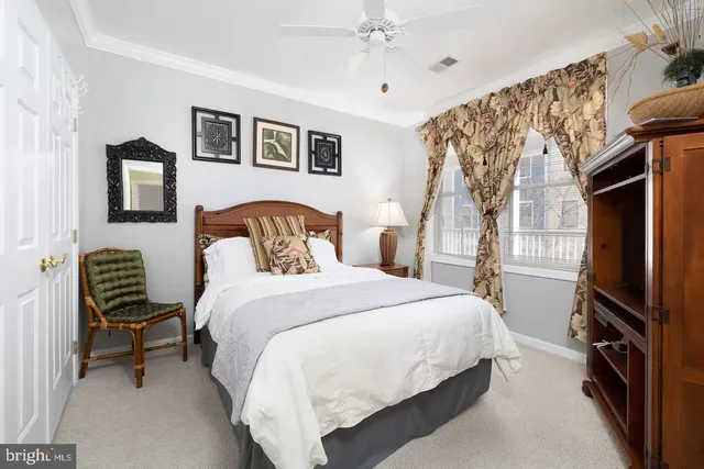 a bedroom with a bed and a television