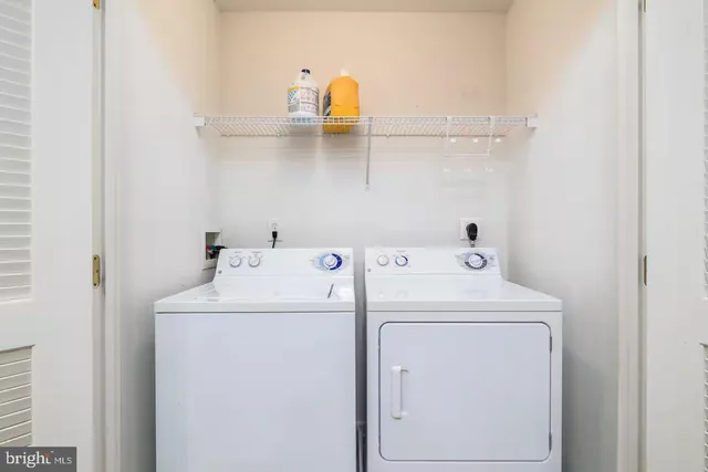 a bathroom with a glass door shower and a sink