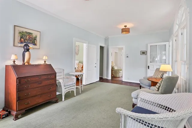 a kitchen with stainless steel appliances a sink a stove and a wooden floors