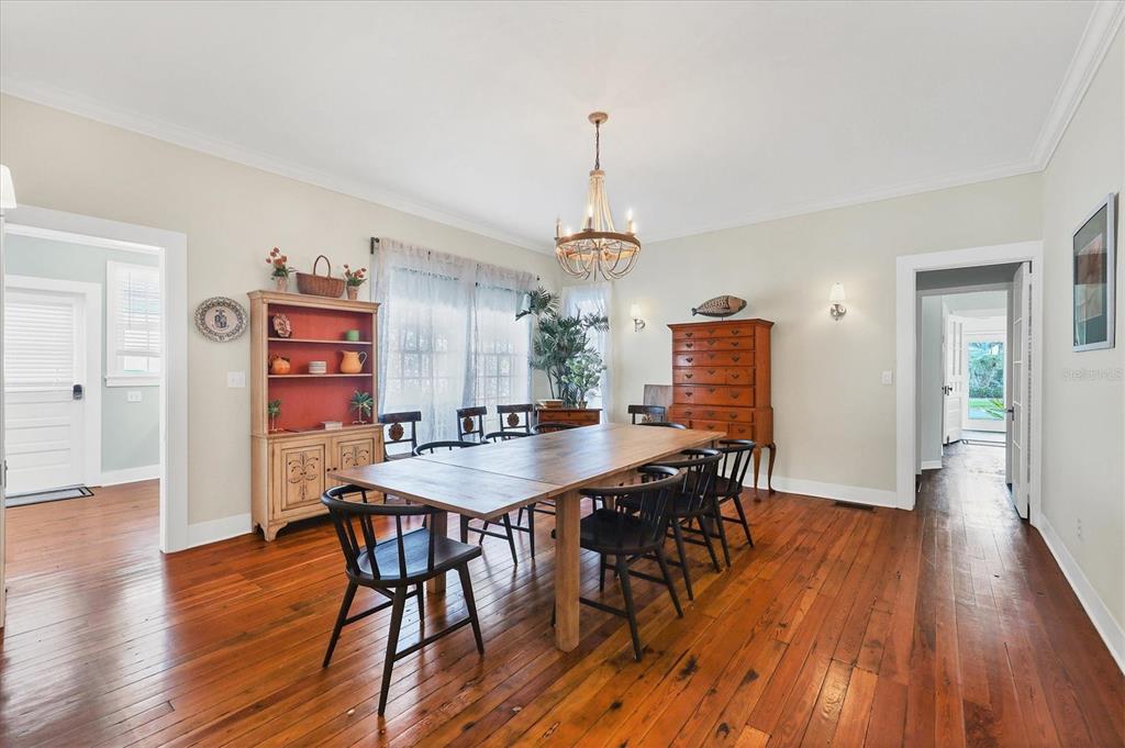 231 Gilchrist Avenue Boca Grande, FL 33921 - Photo 19 of 53 a view of a a dining room with furniture window and wooden floor