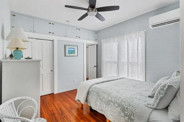 a bathroom with a sink mirror vanity and toilet