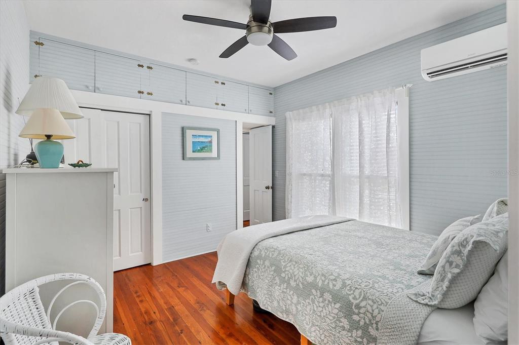 231 Gilchrist Avenue Boca Grande, FL 33921 - Photo 24 of 53 a bedroom with a bed and a couch