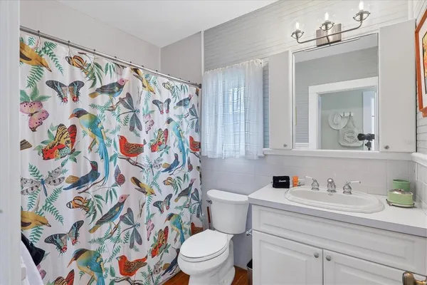 a bedroom with a bed and a rug