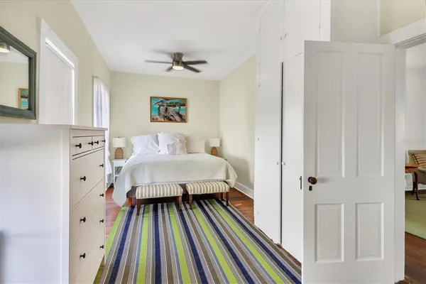 a bathroom with a toilet a sink and a mirror