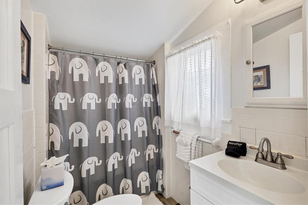 231 Gilchrist Avenue Boca Grande, FL 33921 - Photo 29 of 53 a bathroom with a sink and mirror with toilet