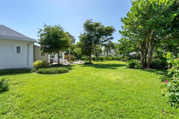 a front view of a house with a yard porch and sitting area