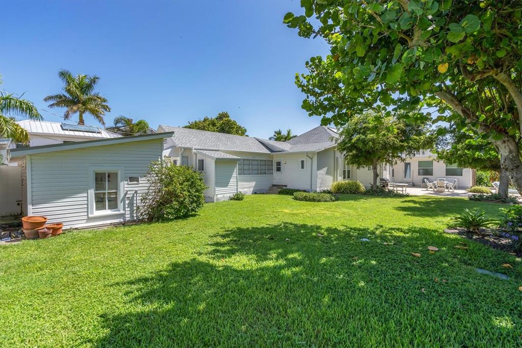231 Gilchrist Avenue Boca Grande, FL 33921 - Photo 40 of 53 a front view of a house with a yard porch and sitting area