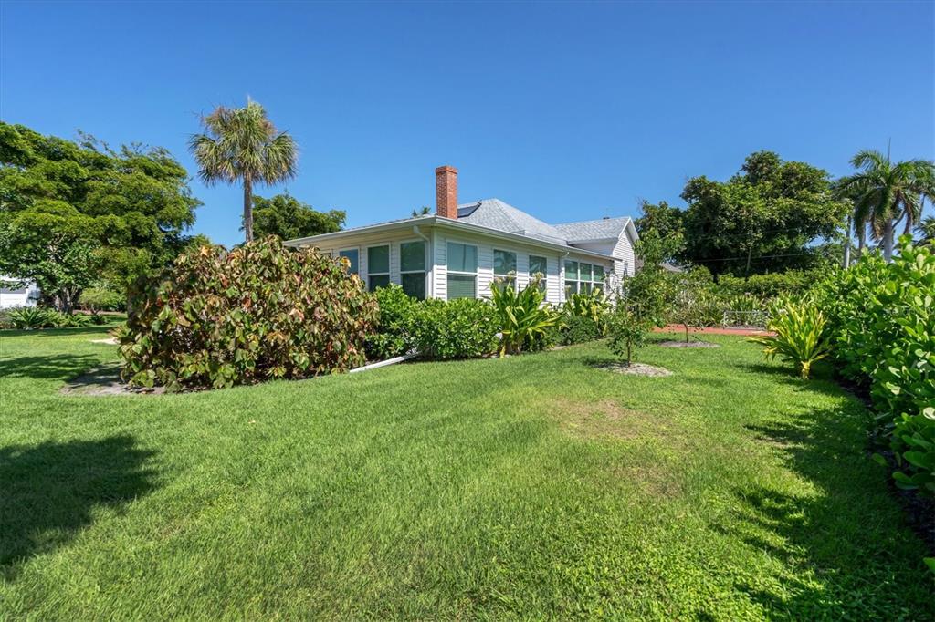 231 Gilchrist Avenue Boca Grande, FL 33921 - Photo 42 of 53 a front view of a house with garden
