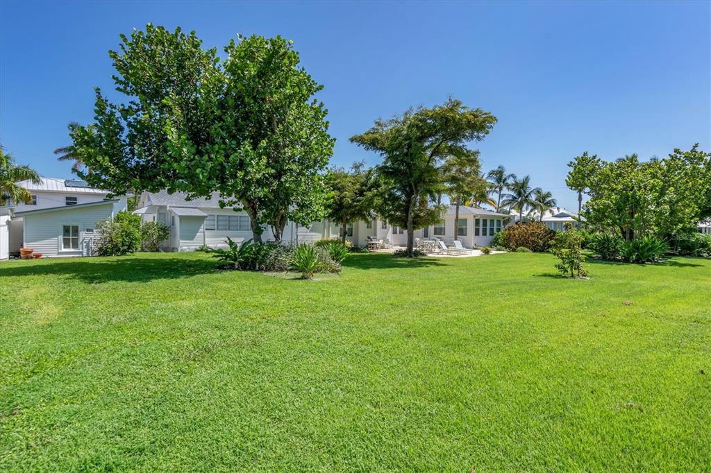231 Gilchrist Avenue Boca Grande, FL 33921 - Photo 44 of 53 a view of house with backyard space and garden