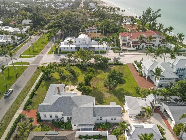 an aerial view of residential building and ocean