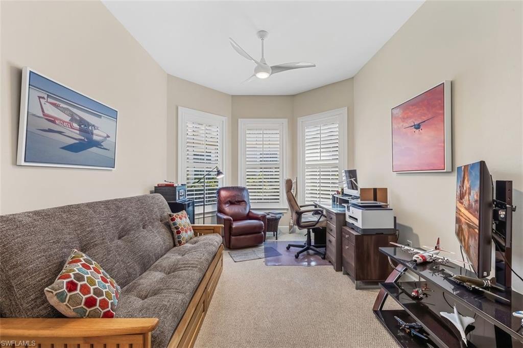 6931 Cay Court Naples, FL 34113 - Photo 12 of 24 Bedroom featuring light colored carpet and ceiling fan