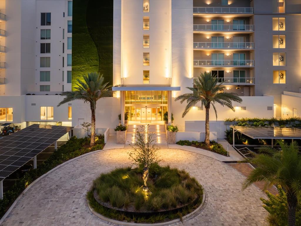 1020 Sunset Point Road, Unit 511 Clearwater, FL 33755 - Photo 11 of 99 a view of a swimming pool with a lounge chairs
