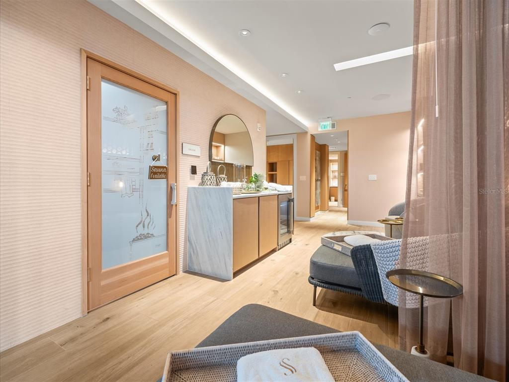 1020 Sunset Point Road, Unit 511 Clearwater, FL 33755 - Photo 37 of 99 a living room with a couch and a table