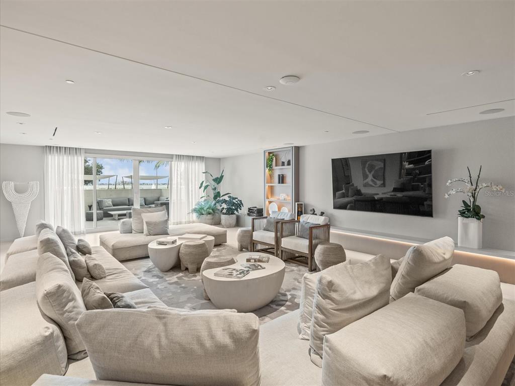 1020 Sunset Point Road, Unit 511 Clearwater, FL 33755 - Photo 45 of 99 a living room with furniture and a large window