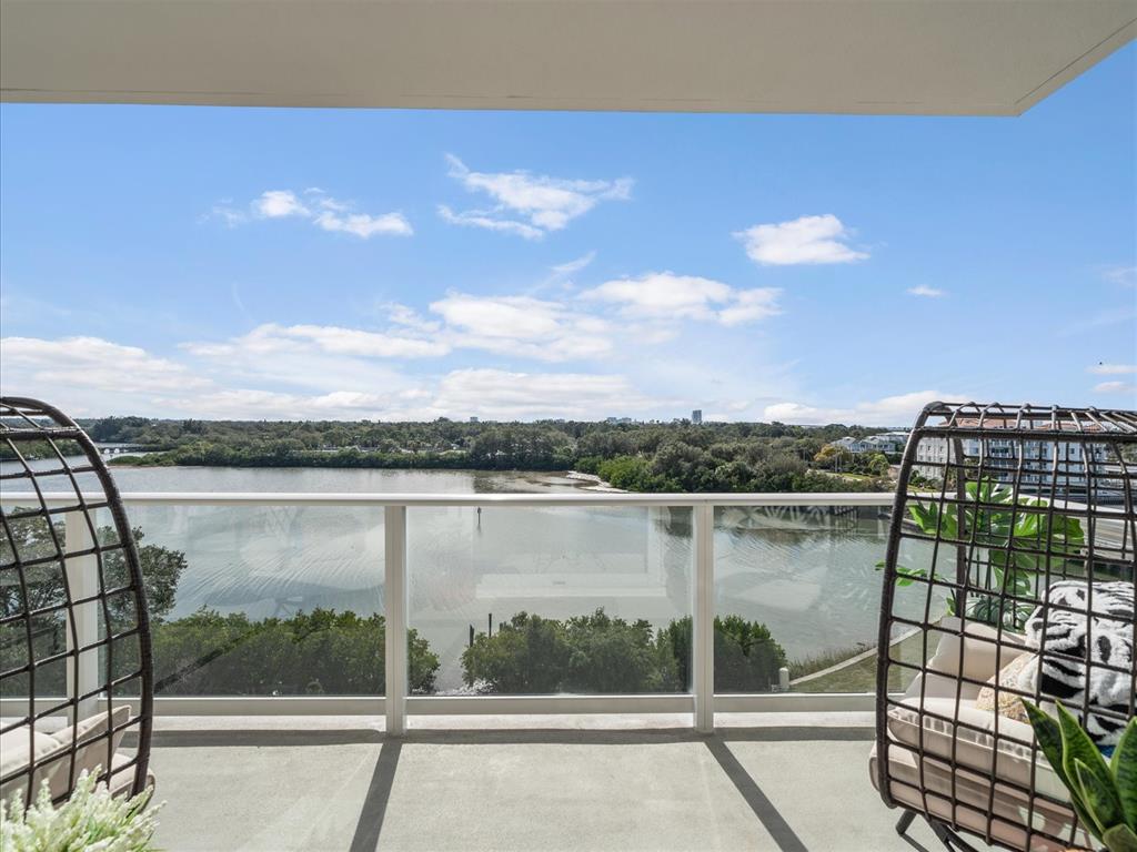 1020 Sunset Point Road, Unit 511 Clearwater, FL 33755 - Photo 80 of 99 a view of a lake from a balcony